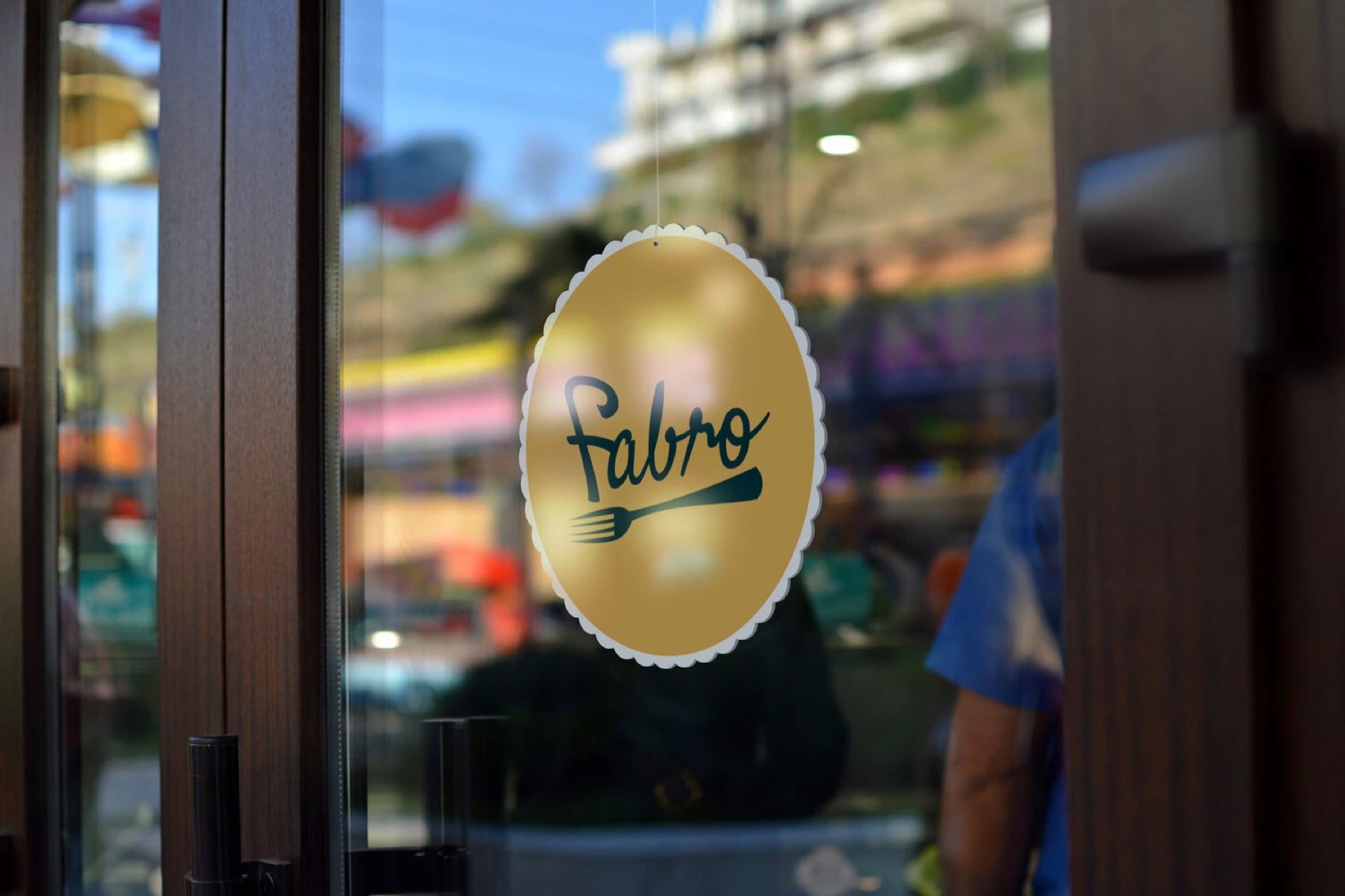 The Fabro logo as a window decal on the restaurant door